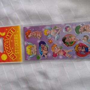 Set of 4 pages of vintage stickers, new in original plastic packaging